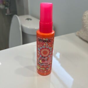 Amika The Wizard Detangling Primer in Orange and Pink